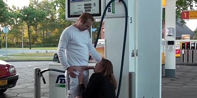 Horny babe is getting fucked on a gas station, in the middle of the day