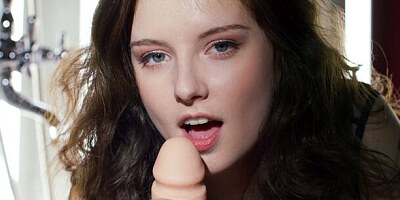 Cute brunette teen Sienna Kim sucks a very long dildo in POV