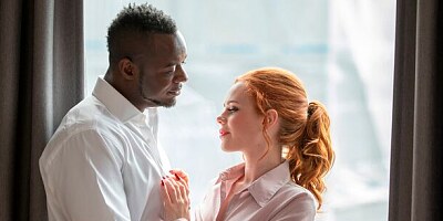 Cute redhead chick Ella Hughes sucks a long black penis on the knees