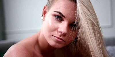 Blonde with nice small tits Katy J. shows off her pink pussy