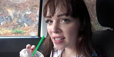 Frisky brunette with full, sensual lips is smoking in the car and spreading her legs wide open