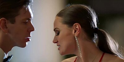 Smashing brunette is sucking two dicks in her bedroom and enjoying every single second of it