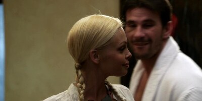 A blonde with pigtails is on her man and she is riding cock