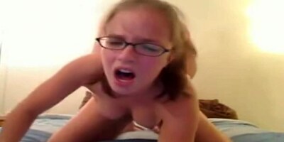 Nerd girl with ponytails riding on webcam