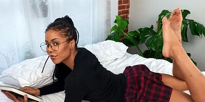 Cute ebony with long legs Kira Noir stimulates her wet hole