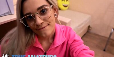 Good-looking teen in glasses is sucking a large dick after hot sex
