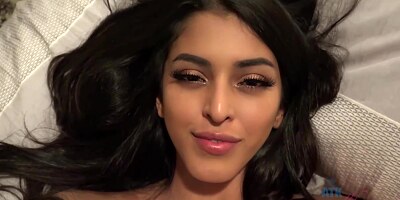 Gorgeous brunette with small boobs, Sophia Leone is smoking and giving a hot, POV footjob