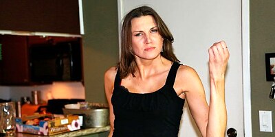 Lusty brunette with long legs Valerie Voxx strokes a big cock