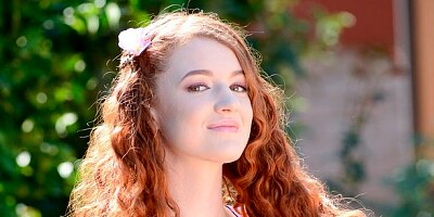 Playful redhead model Abbey Rain jumps on a long dick