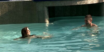 A hot brunette plays with her man in the pool and in the bedroom