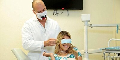 Two doctors are testing Stephanie West's tight holes in the ward