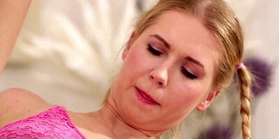 Two blonde chicks are doing sexy things to each other on the floor