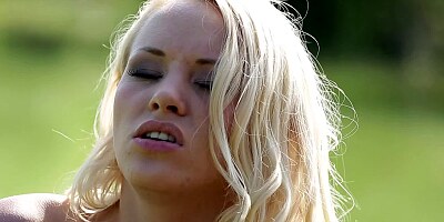 A blonde solo girl is pushing her fingers inside her wet pussy