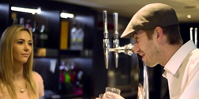 A horny babe does a blow job to a guy on the red sofa