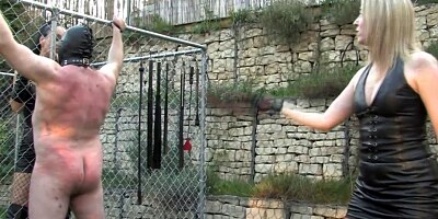 Femdom harshly punish sub with whips outdoor