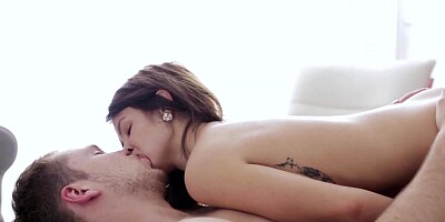 A brunette with large nipples on her natural tits is handling dick