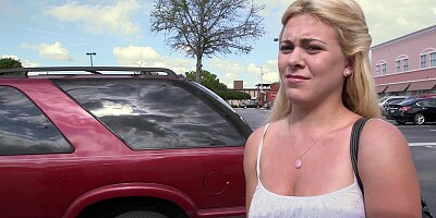 A lust filled blonde is getting undressed in the back seat of a car