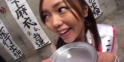 Asian girl swallows cum from a plate