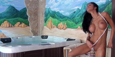 A solo girl is next to a hot tub, getting her pussy caressed