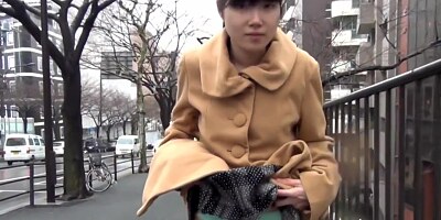 Asian teen pulls up skirt