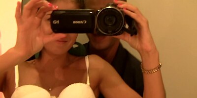 A sexy girl that is filled with lust is trying on some hot lingerie
