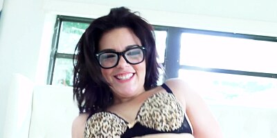 Chick with glasses that has a shaved cunt is spreading her legs