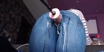 Fucking machine penetrates webcam girl thorough a hole on her jeans