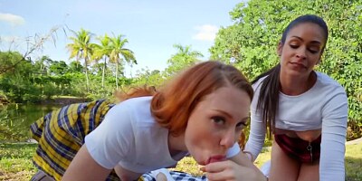 Depraved schoolgirls are having a threesome in the sunny day