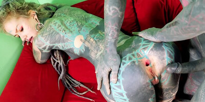 Totally tattooed freak with long dreadlocks fucks his girlfriend