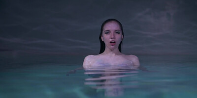 Lovely lesbians are swimming and scissoring together