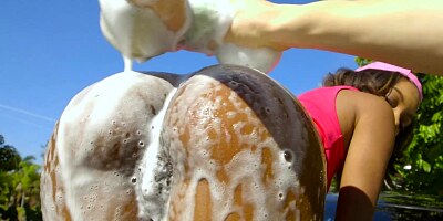 Spicy Latina chick is giving a blowjob after washing guy's car