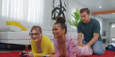 Interracial threesome makes the girls forget about video game