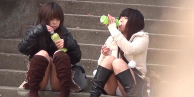 Japanese babes in boots get panties peeped on