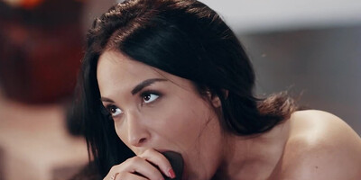 Busty brunette loves stuffing her mouth with a giant black rod