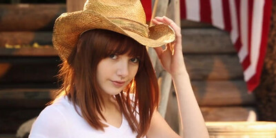 American patriot in a straw hat masturbates outdoors