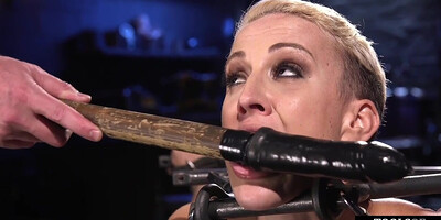 BDSM sub bound to floor and toyed with dildo and vibrator