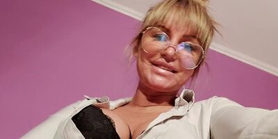 Mistress Zabava talks dirty while cock-teasing on the couch