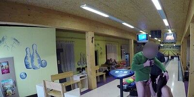 Petite brunette gal sucking a cock in the bowling alley