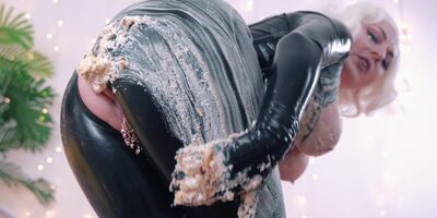 Stunning blonde in latex clothes rubs food all over her sexy body
