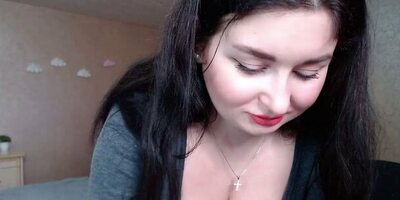 Curvy Russian hottie with black hair strips and shows her tits off