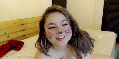 The cat sucks off the dildo