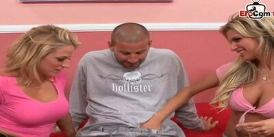 Two busty blonde babes share a big cock in a FFM 3some