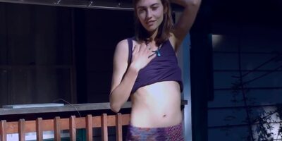 Cute Hippie Dancing In Skirt On Wooden Porch