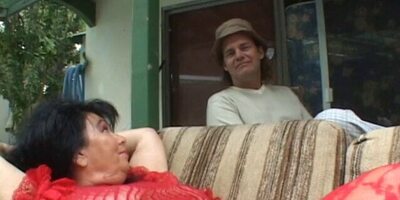 MILF with huge breasts rides a big cock outside