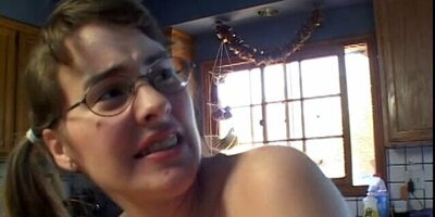 Hot young brunette takes a load on her glasses after getting fucked