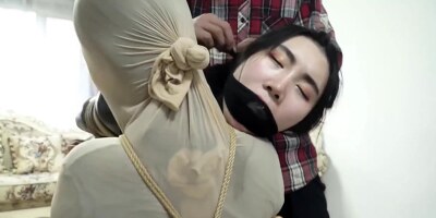 Tied Together With Her Humiliated Victim