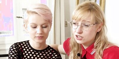 Two flashy lesbians are being interviewed and involved in a hot action