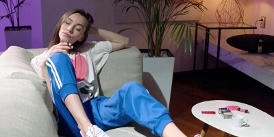 Babe plays with herself while smoking and watching porn