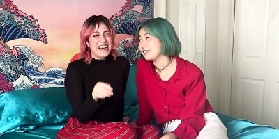 Two kinky lesbian nymphos are shoving a huge dildo in their pussies