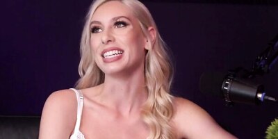 Tall blonde pornstar Kay Lovely is being interviewed on a talk show